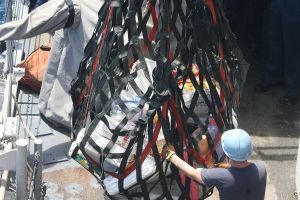 Flickr - Official U S Navy Imagery - A Sailor guides a cargo net loaded with bales of cocaine recently recovered from a drug interdiction off the Pacific coast of Colombia.jpg